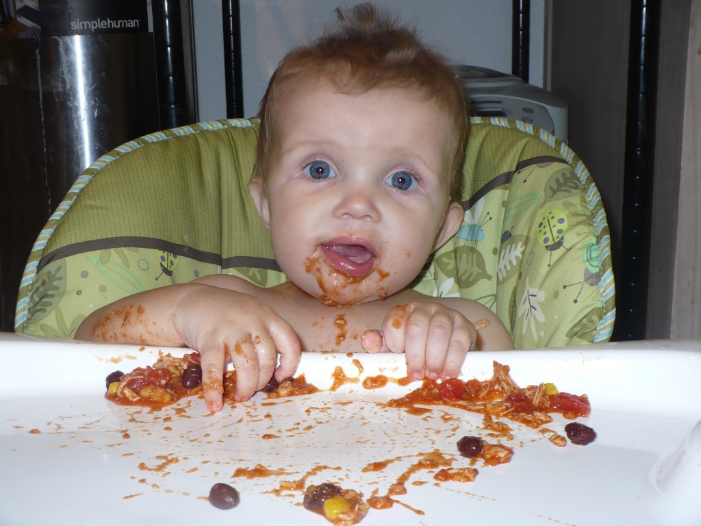 baby enjoying nacho
