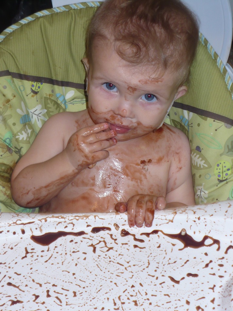 baby covered in pudding
