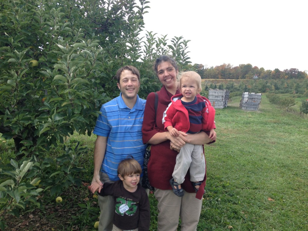 family at an apple orchard