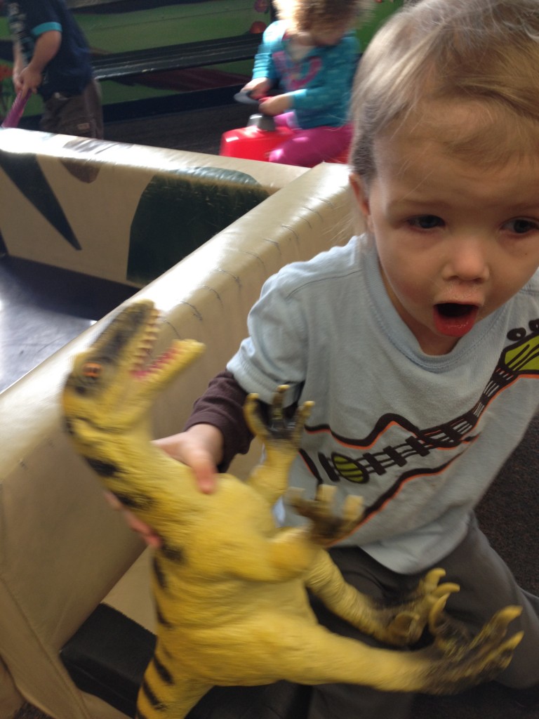 child with dinosaur