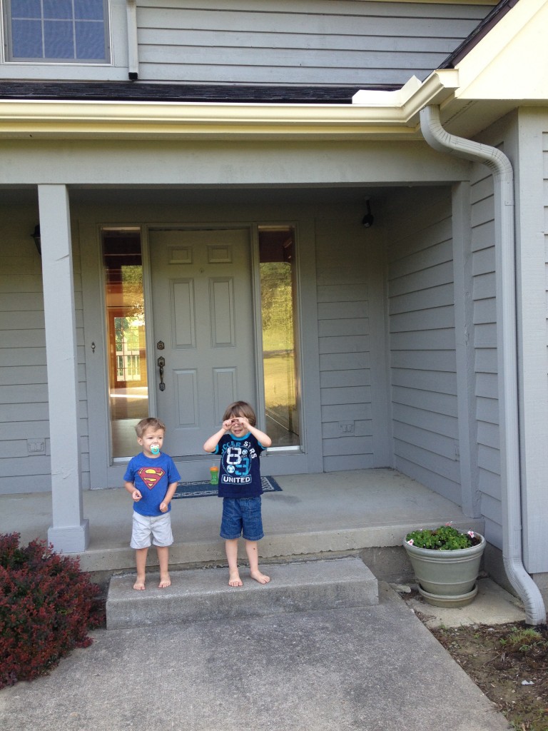 boys in front of house