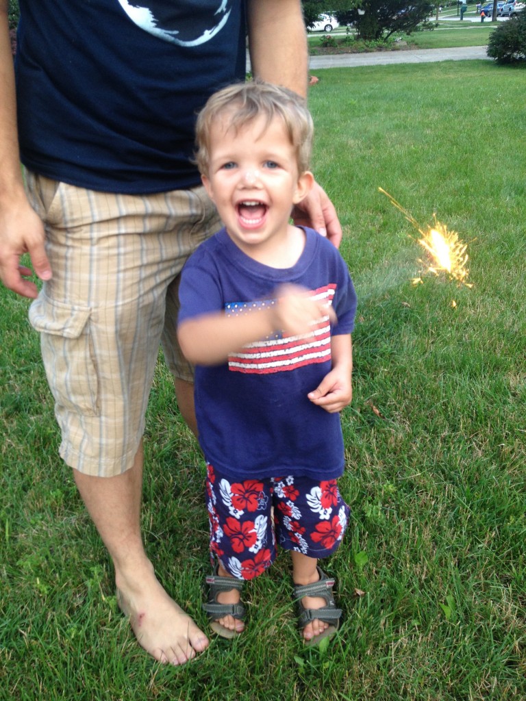 boy holding a sparkler